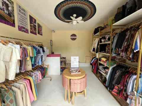 A shot of the Balik Batik store showing racks of indigenous weaves in clothing