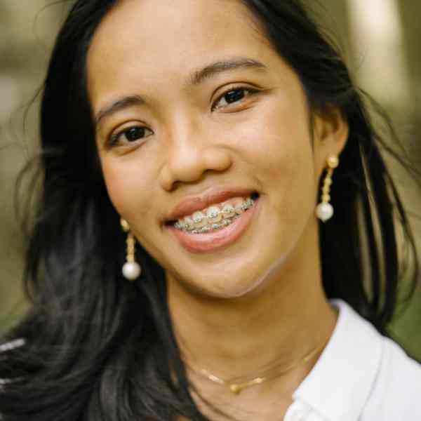 Photo of Rosalin Angelu Baliton (Filipina wearing a white collared shirt)