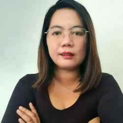 Photo of Lorilyn P. Daquioag (Filipina wearing glasses and a black top, crossing her arms)