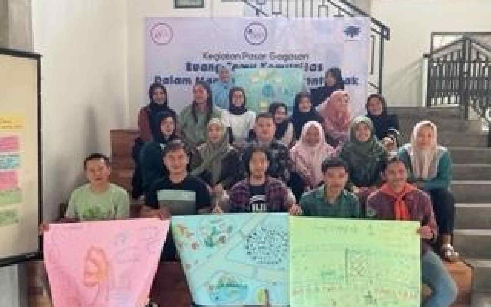 A group of Indonesians hold up posters of their drawings